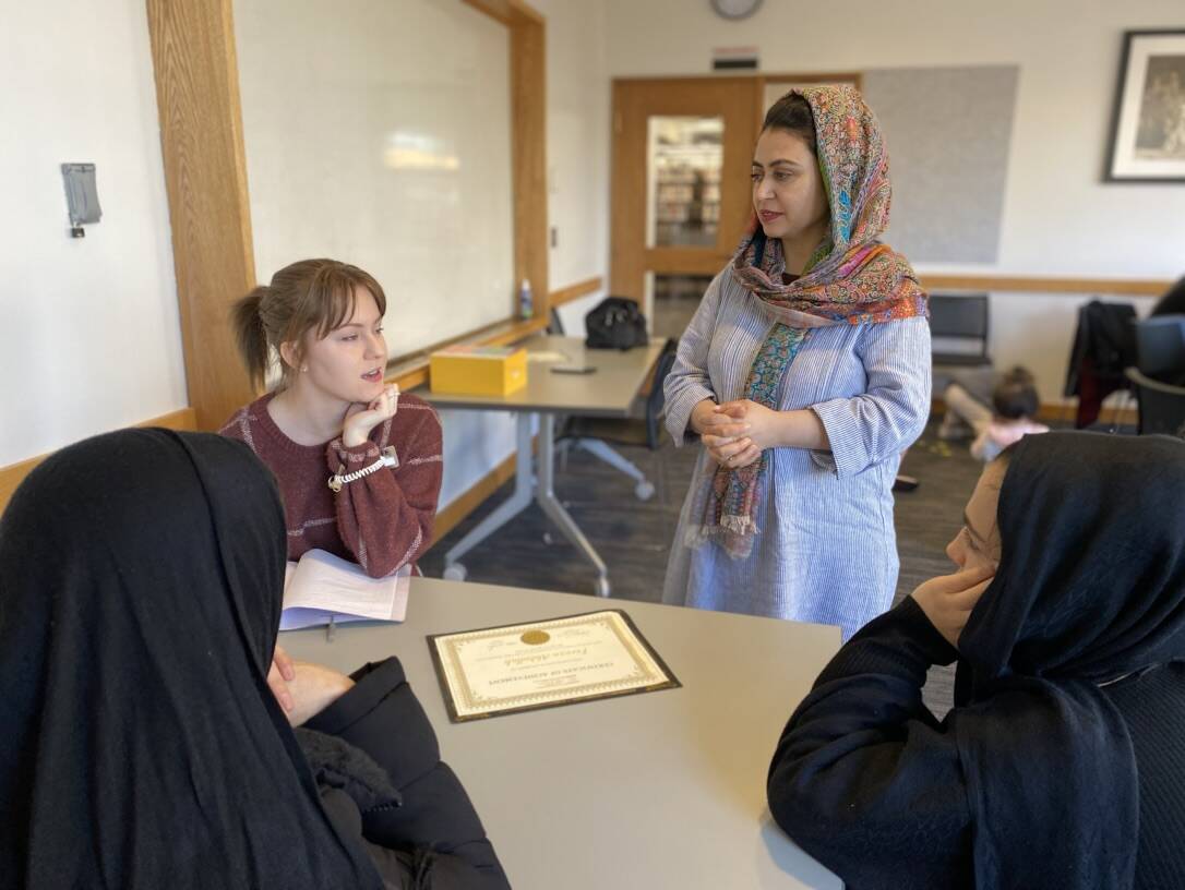 Photo provided
Teacher Parwin gives a presentation to students at a local library.