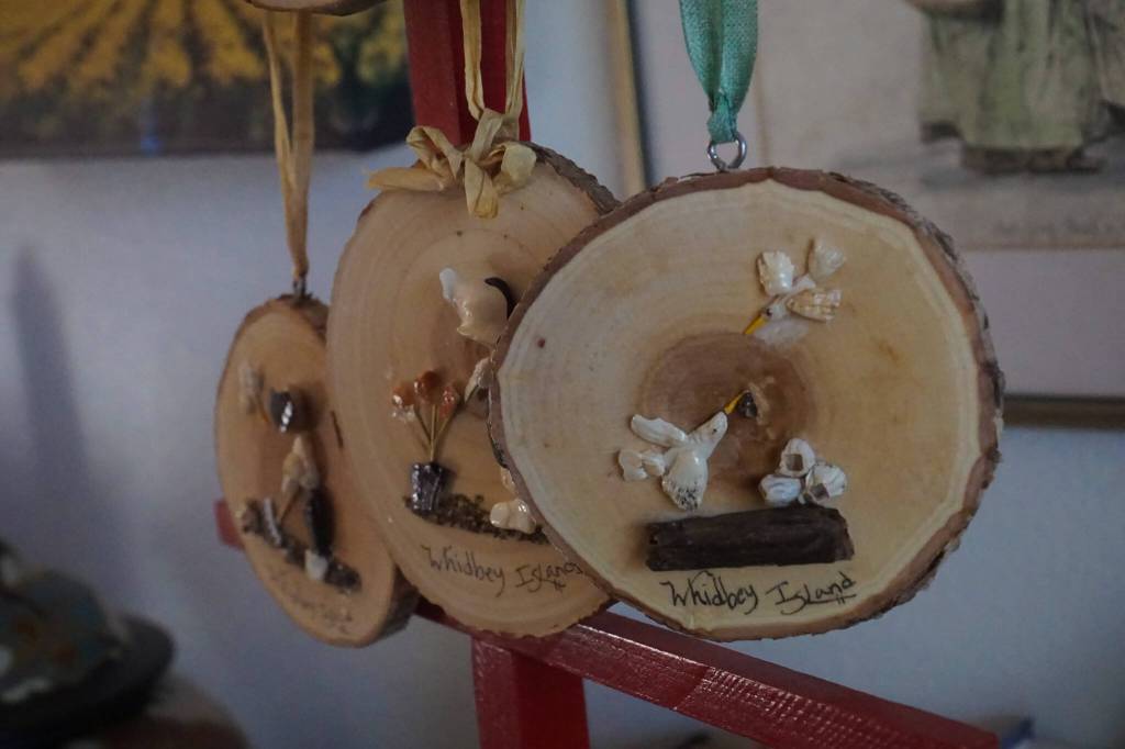 Made entirely of shells, rocks, odds and ends from the beach, Hammers work portrays wholesome scenes of sisters playing, fishermen and families interacting with Whidbeys scenery. (Photo by Sam Fletcher)