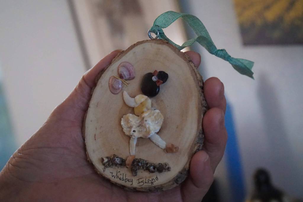 Photo by Sam Fletcher
Made entirely of shells, rocks, odds and ends from the beach, Hammers work portrays wholesome scenes of sisters playing, fishermen and families interacting with Whidbeys scenery.