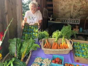 Photo by Kirstin Clauson
Anza Muenchow of Maha Farm sold her vegetables at last years South Whidbey Tilth Farmers Market.