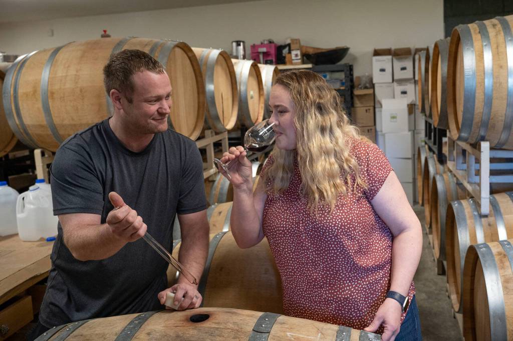 Michelle Graham samples a glass of wine. She and her husband, Kyle ONeill, are the owners of Leo & Letos, formerly known as Blooms Winery. (Photo by David Welton)
