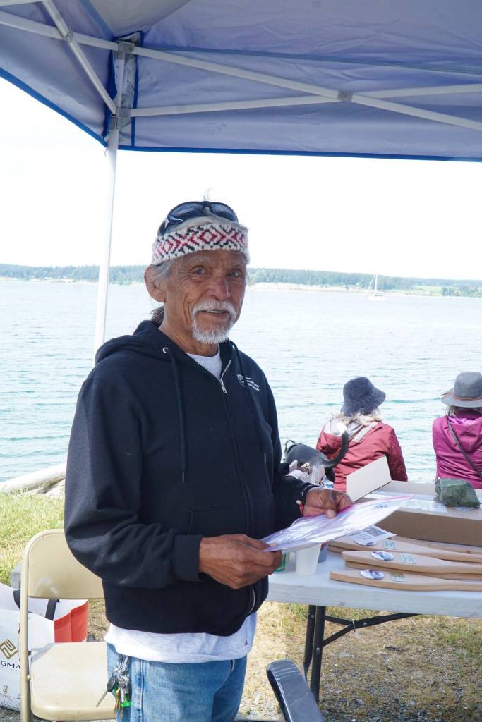 Tony Cladusbid, co-owner of the Beaver Tales Coffee franchise, works the Penn Cove Water Festival on Saturday. (Photo by Sam Fletcher)