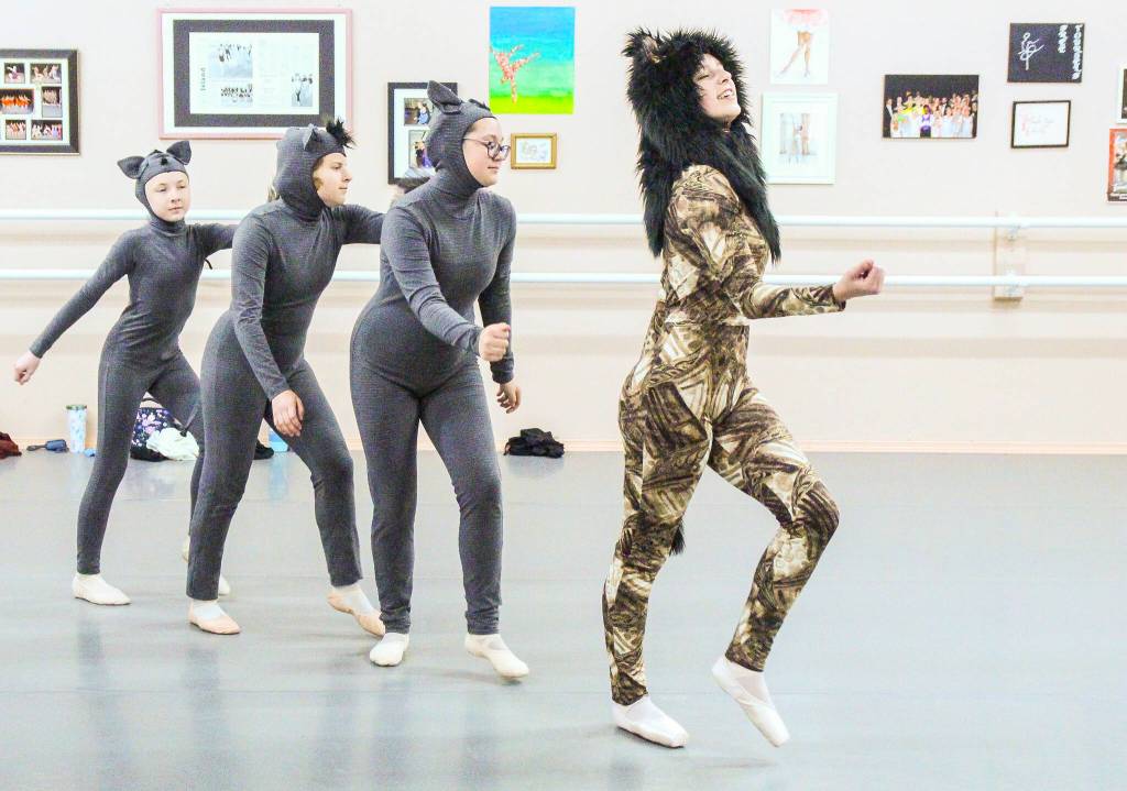 At left, Eliza Foster, Grace McGrath, Desiree Walton (the hyenas) and Riley White (Simbas evil uncle Scar) dance to Be Prepared. (Photo by Luisa Loi)