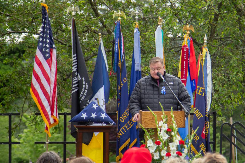 Oak Harbor Mayor Ronnie Wright welcomes the attendees to the Memorial Day Service of Remembrance at the Maple Leaf Cemetery on May 27. (Photo by Caitlyn Anderson)