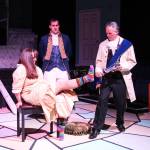 A peasant woman impatiently waits for Lionel (Bill Larsen) to help her into the glass shoe in front of a perplexed Prince Christopher (Jordan Kingma). But could this be the fair maiden the young man is desperately looking for? (Photo by Luisa Loi)