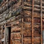 Photo by Patricia Guthrie
The Langley log cabin was most likely originally constructed as a one-room, one-story structure by loggers who were adept at precisely falling and cutting timber to create strong, solid dwellings. Its second floor was added later using smaller diameter logs.