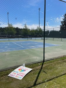 Photo provided
A community member affixed a sign on June 6 affirming that LGBTQ+ youth are loved and belong. It was subsequently removed and left behind on the grass on June 8.