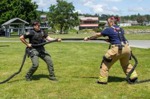 Deputy Sheriff Laurrin Bates (left) and Firefighter Kat Crowe (right) play tug of war in anticipation of the police and firefighter 5k run and tug of war competition, June 12. (Photo by Caitlyn Anderson)
