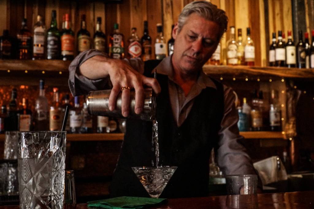 Photo by Sam Fletcher
Bartender Chris Uhler mixes a drink at Barringtons Irish Bar & Grill on Pioneer Way in Oak Harbor.