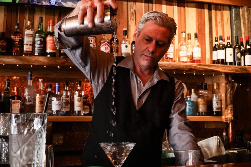 Bartender Chris Uhler mixes a drink at Barringtons Irish Bar & Grill on Pioneer Way in Oak Harbor. (Photo by Sam Fletcher)