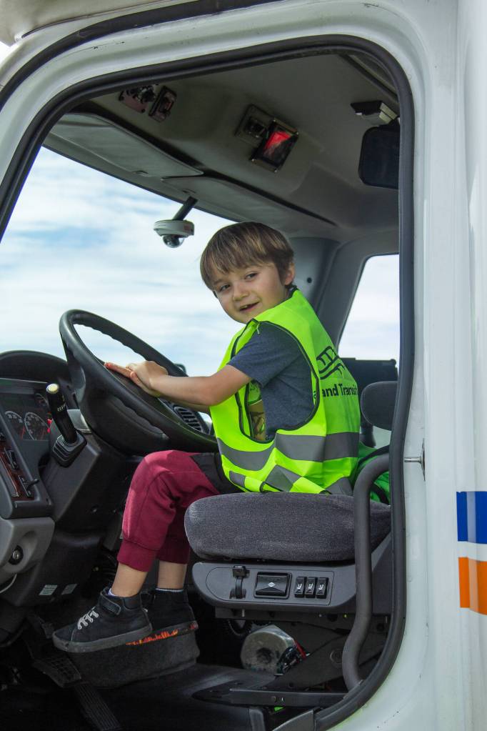 Photo by Caitlyn Anderson
Lukas Walker honks the horn on the Island Transit shuttle at the Touch-a-Truck event hosted by Big Brothers Big Sisters of Island County on May 22.