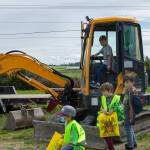 Photo by Caitlyn Anderson
Aiden Stevens plays with the track pedals and levers in a backhoe at the Touch-a-Truck event.