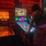 A Tossin Axes patron plays the new John Wick pinball machine at Fridays launch tournament. (Photo by Caitlyn Anderson)