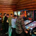 Photo provided
Tossin Axes patrons play pinball at Fridays launch tournament.