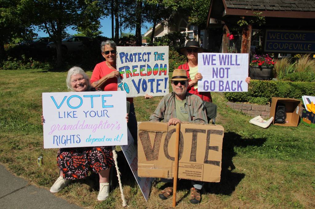 Photo by Luisa Loi
Mikki Lipsey, Steve Lipsey, Cary Chapin and Linda Werhman reminded drivers to vote this November. Six out of nine U.S. Supreme Court justices were appointed by Republican presidents. A Democrat president could appoint justices with more liberal leanings in case of a vacancy on the court.