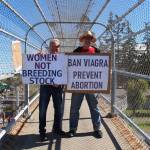 Photo by Luisa Loi
Russell Harvey and Simon Butler held signs on the Coupeville overpass.