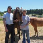 David (left) and Melissa (right) Tucker pose for a picture with their horse at Willow Ranch, June 25. (Photo by Caitlyn Anderson)