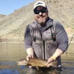 Photo Provided
Whidbey Island Fly Fishing Club member Jeff Stum holds a freshly-caught trout.