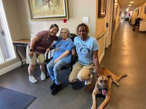 Photo provided
Left to right: Activities Director Katie Cook, Resident Pam Castanera, Head of Housekeeping Shanika Plummer and Kiro pose after a remarkable day at Welcome Home Oak Harbor.