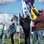 Tim Hazelo, at right, rallies for the Island County Republican Party not far from the spot where he helped save the lives of four people who overdosed. (Photo by Sam Fletcher)