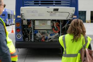 The hydrogen-powered guts of a new zero-emission Community Transit bus are seen under an open hood at the Community Transit Operations Base in Everett. (Ryan Berry / The Herald)