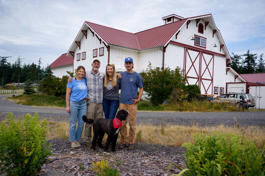 (Photo by David Welton)
From left, Lauren, Britt, Linda and Kai Fletcher of Mutiny Bay Blues with Shep the farm dog.