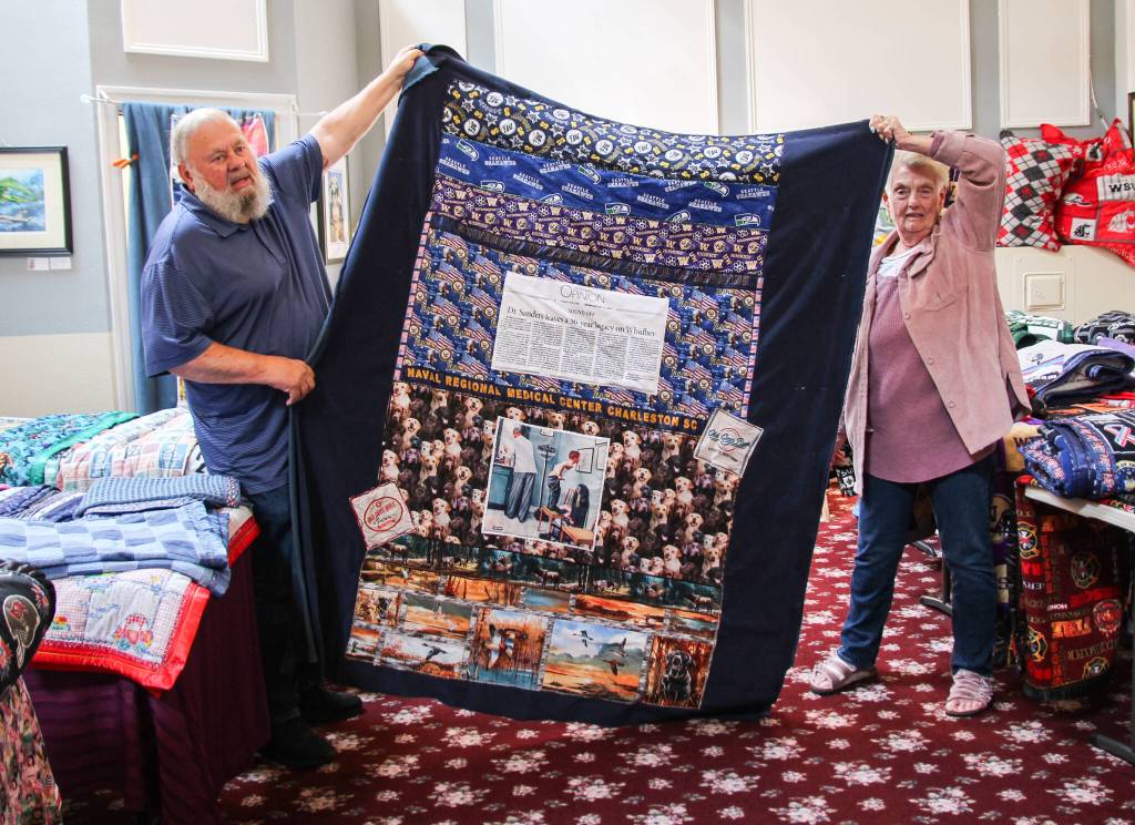 Mary and her husband hold a blanket. (Photo by Luisa Loi)