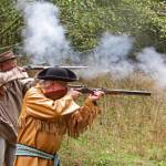 Rendezvous participants shoot targets while wearing clothes based on the fur trade era. (Photo by Roger Robertson)