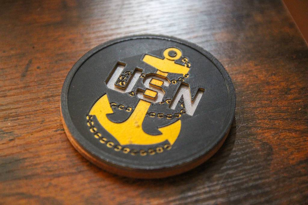 A 3D printed coaster with a cork bottom. (Photo by Luisa Loi)