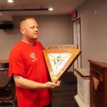Photo by Sam Fletcher
Fleet Reserve Association Branch 97 President Brent Hundley holds a FRA clock at the Crows Nest Lounge on 8th Ave.