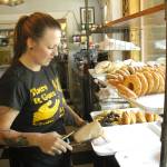 Photo by Kira Erickson/South Whidbey Record
Jessica Monaghan grabs a doughnut from the case.