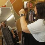 Photo by Kira Erickson/South Whidbey Record
Liz Smith holds up a jumpsuit, a bestselling item in Island Boutique.