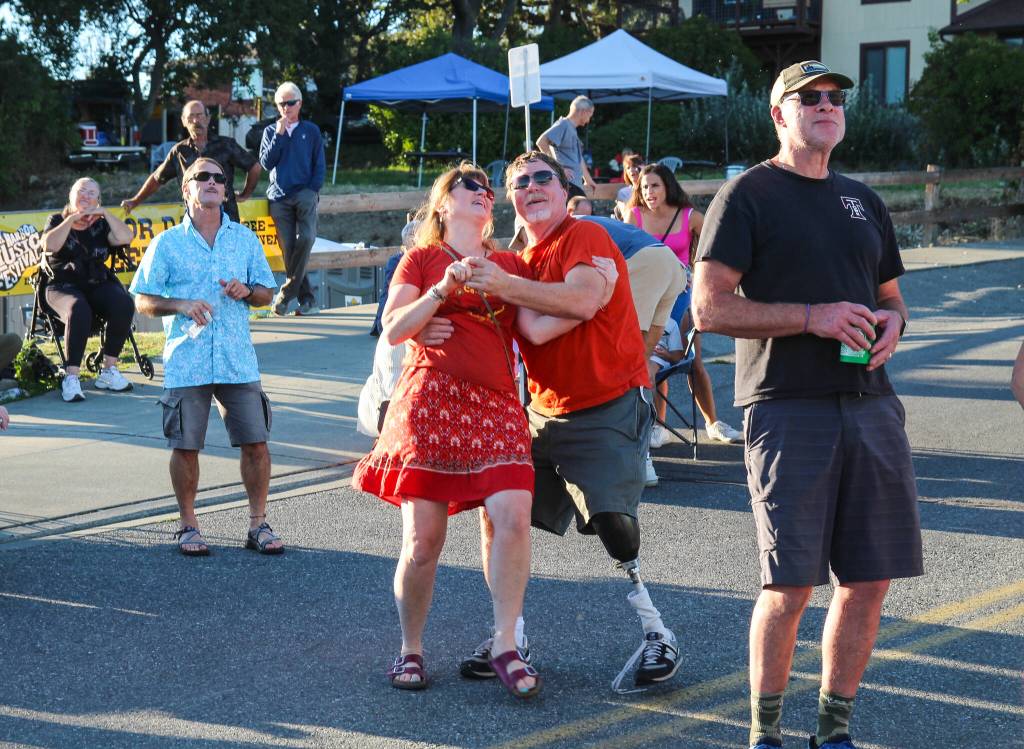 Photo by Luisa Loi
A couple happily dances to the sound of Locarno, a latin fusion band from Canada.