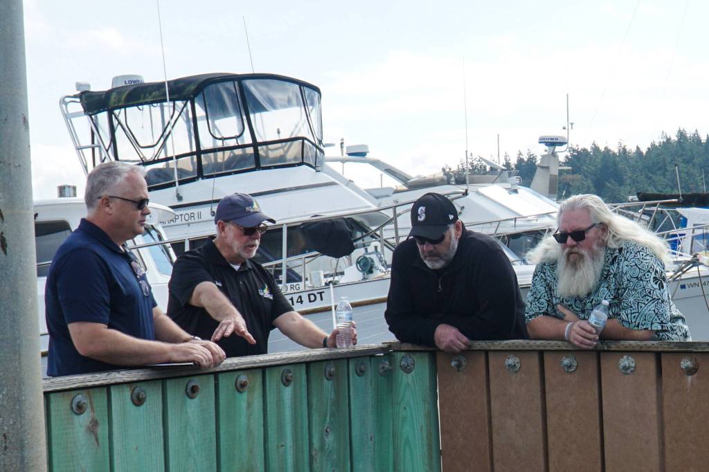 Left to right: Parks and Recreation Director Brian Smith, Harbor Master Chris Sublet and Councilmembers Eric Marshall and Christopher Wiegenstein discuss the future of the Oak Harbor Marina Thursday morning. (Photo by Sam Fletcher)