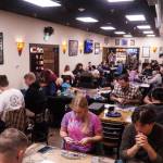 The Book Rack game room fills for Friday Night Magic. (Photo by Sam Fletcher)