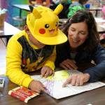 Superintendent Michelle Kuss-Cybula helps a student.