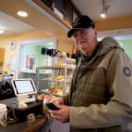 Tom Campbell steps up to the register to donate to the South Whidbey Commons fundraiser. (Photo by David Welton)
