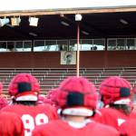 A team photo with the Stanwood High School Spartans logo in the background at Bob Larson Stadium in Stanwood, Washington on Aug. 30, 2024. (Taras McCurdie / The Herald)