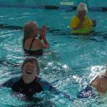 Photo by Sam Fletcher
Brenda Haworth smiles while playing volleyball at the John Vanderzicht Memorial Pool Monday morning.