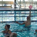 Ken Milke catches the volleyball at the John Vanderzicht Memorial Pool Monday morning. (Photo by Sam Fletcher)