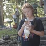Leonidas Mitchell, 9, holds a call duck.
