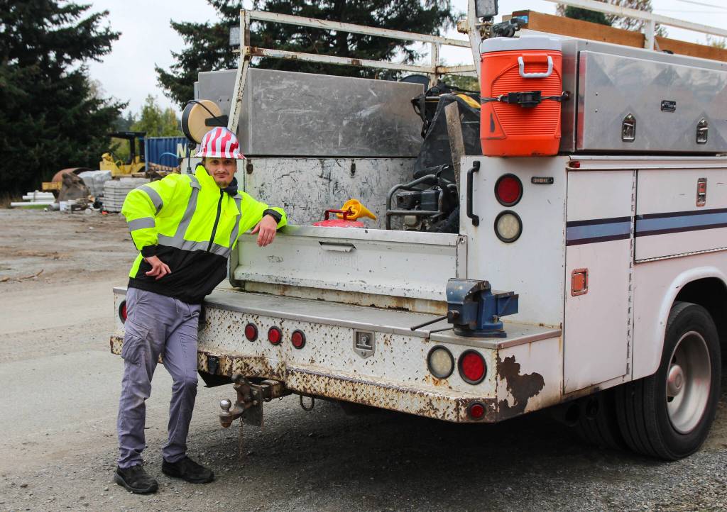 (Photo by Luisa Loi)
Derek leans on one of his favorite trucks.
