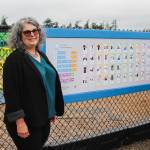 (Photo by Luisa Loi)
Tonia Johnston poses by the communication board at Hillcrest Elementary.