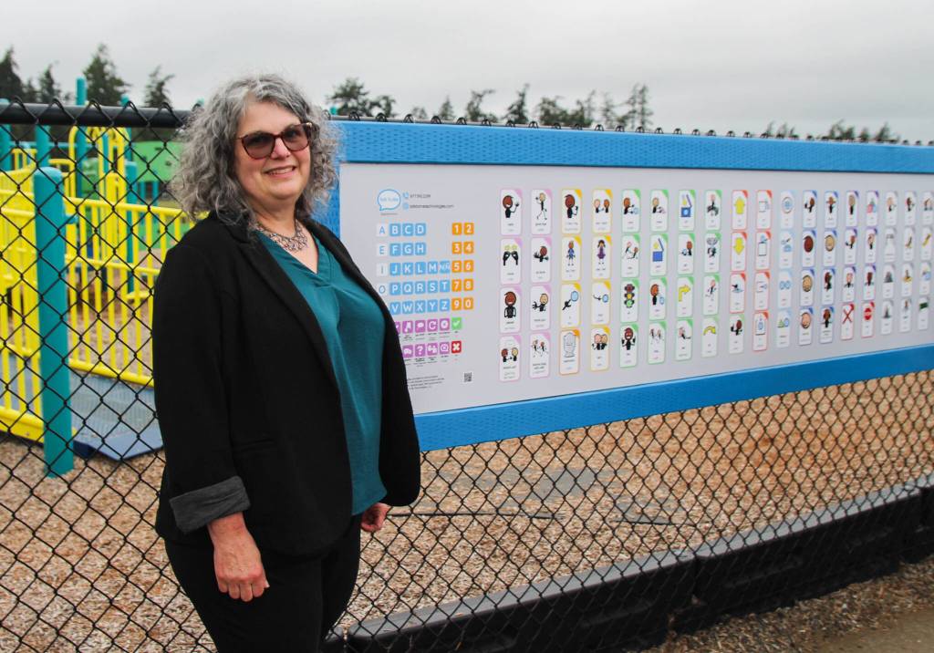 (Photo by Luisa Loi)
Tonia Johnston poses by the communication board at Hillcrest Elementary.