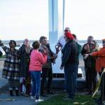 Members of the City of Oak Harbor and Sculpture Northwest cut the ribbon for the Angel de Creatividad, Oak Harbors new 40-foot sculpture at Flintstone Park on Thursday. (Photo by Sam Fletcher)
