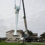The Angel De Creatividad sculpture took flight on Wednesday as Ram Construction riggers move it in place. (Photo by Sam Fletcher)