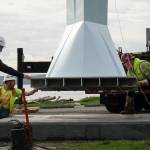 The Angel De Creatividad sculpture took flight on Wednesday as Ram Construction riggers move it in place. (Photo by Sam Fletcher)