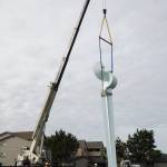 Ram Construction staff prepare to mount the Angel De Creatividad sculpture on its platform on Wednesday. 
Photo by Sam Fletcher