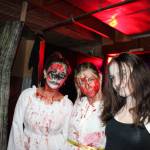 Scare actors from left: Savannah Gomez, Evelyn Vice and Miley Dutton pose at Twisted Manor at the Oak Harbor Roller Barn. (Photo by Sam Fletcher)