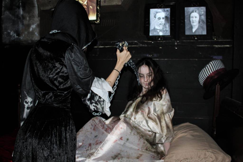 Scare actors Dori Ledger, left, and Miley Dutton rehearse for Return of Frightville in Oak Harbor. (Photo by Sam Fletcher)